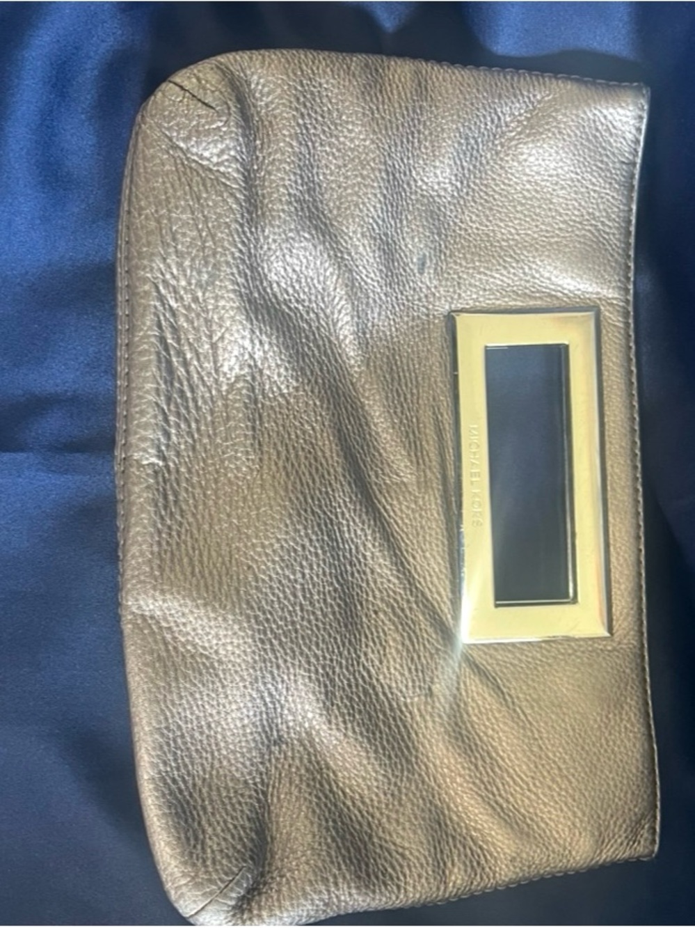 Michael Kors bronze pebbled leather wristlet with gold plaque
